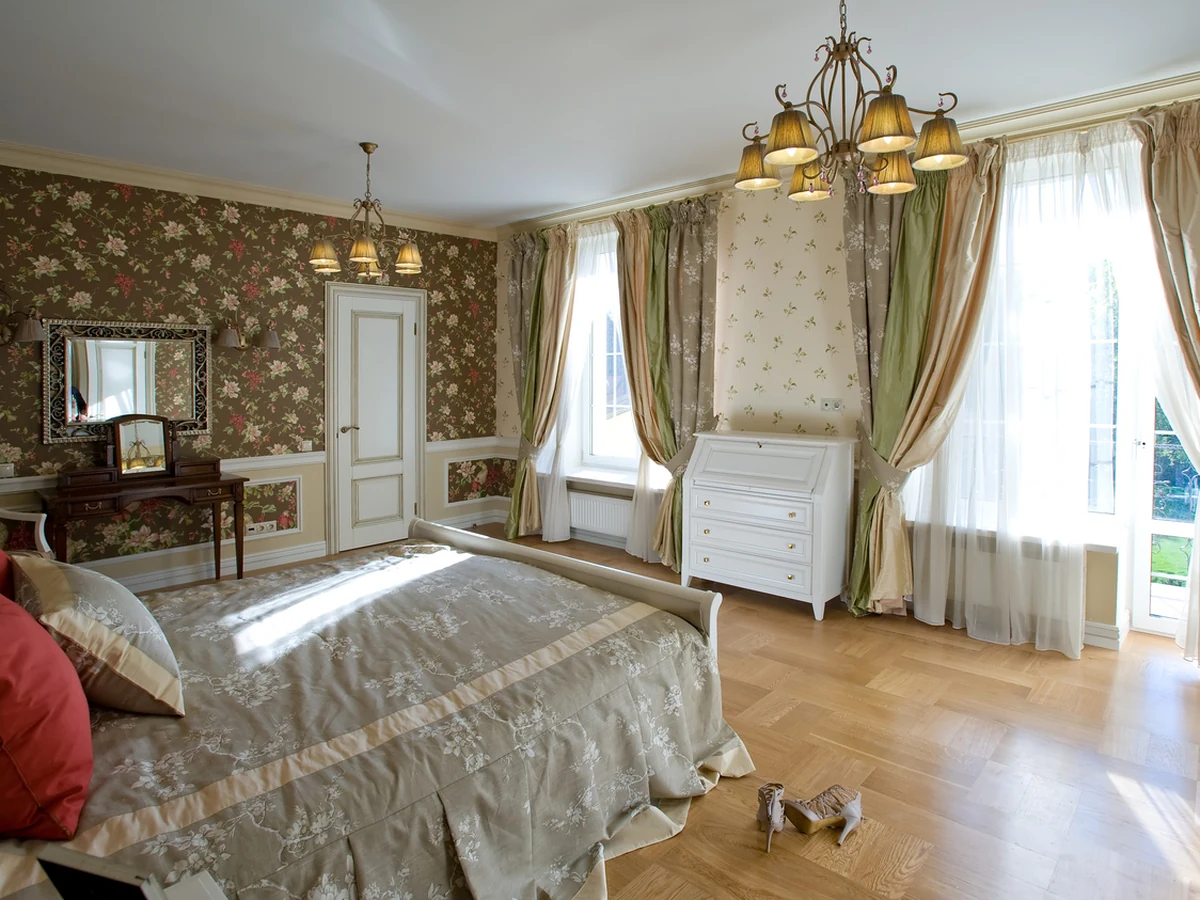 Traditional bedroom with floral wallpaper by York Painters