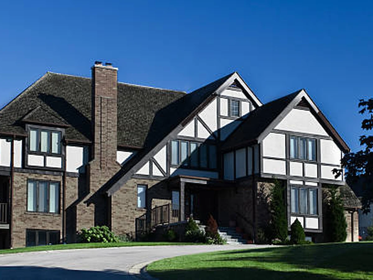Large mock-Tudor property with painted exterior woodwork and window frames by York Painters