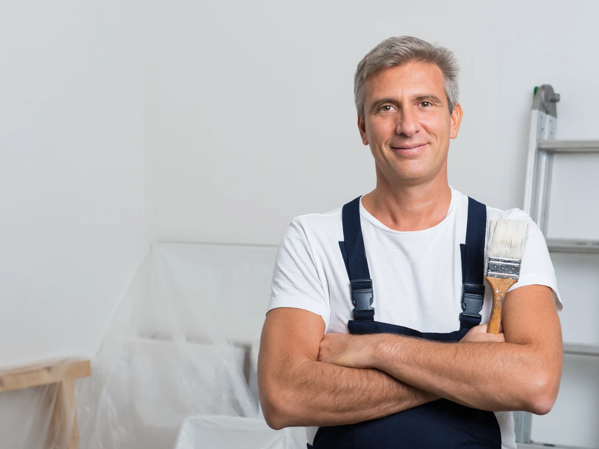 painting-decorating-confident-painter-standing-york-painters York Painters decorator ready to begin a feature wall painting project