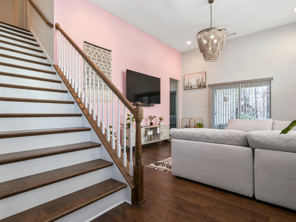 Open white staircase with painted spindles and newel posts by York Painters