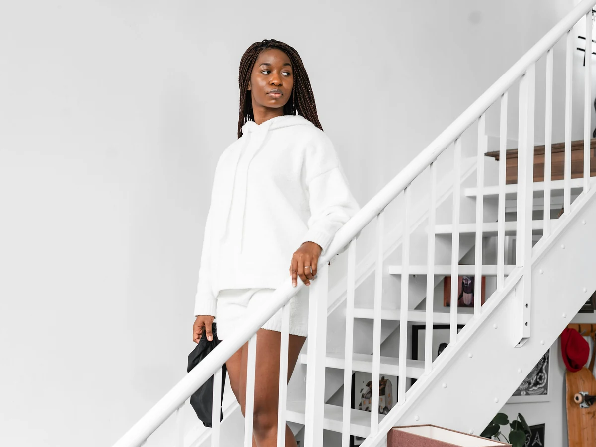 Woman on a freshly painted white staircase by York Painters